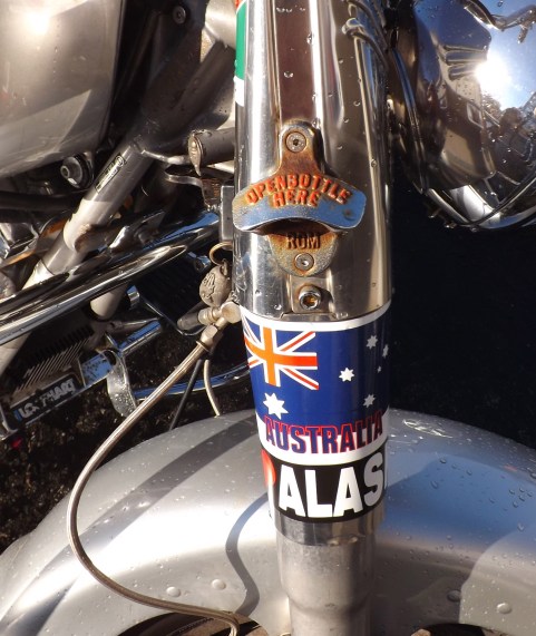 The bottle opener, his Australia flag sticker, and his new "I <3 Alaska" sticker.
