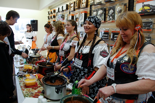 2012 Contestants serving chili during the chili cook-off